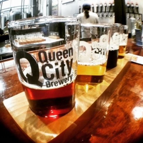 Beer glasses with Queen City Brewery logo