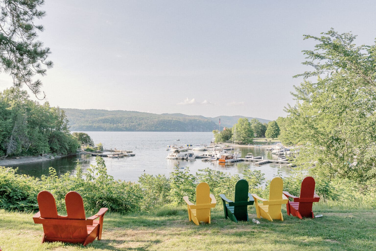 View of Adirondack chairs facing harbor