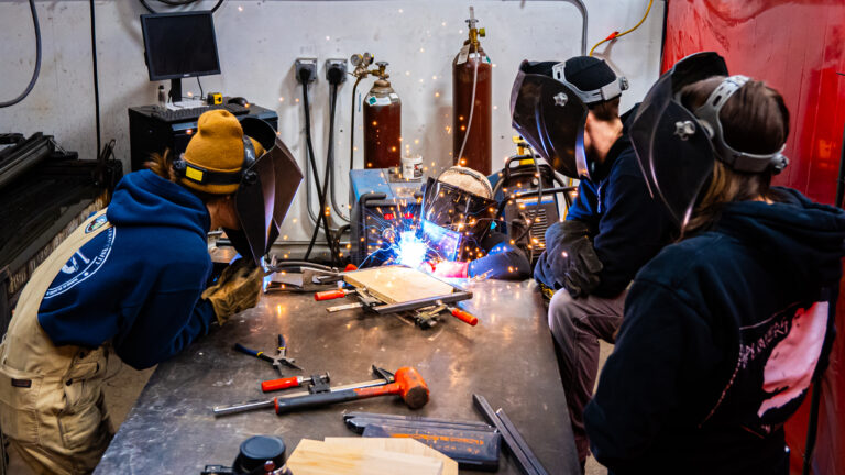 A group of women welding metal at Generator in Burlington